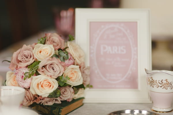 Flowers and pink table name sign