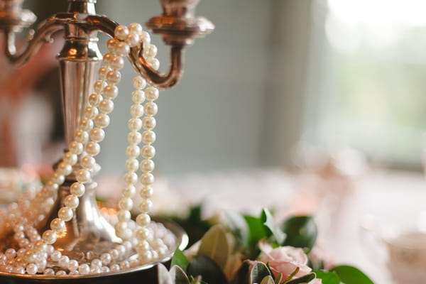 Pearls over candle stick