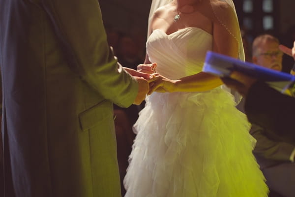 Bride and groom holding hands