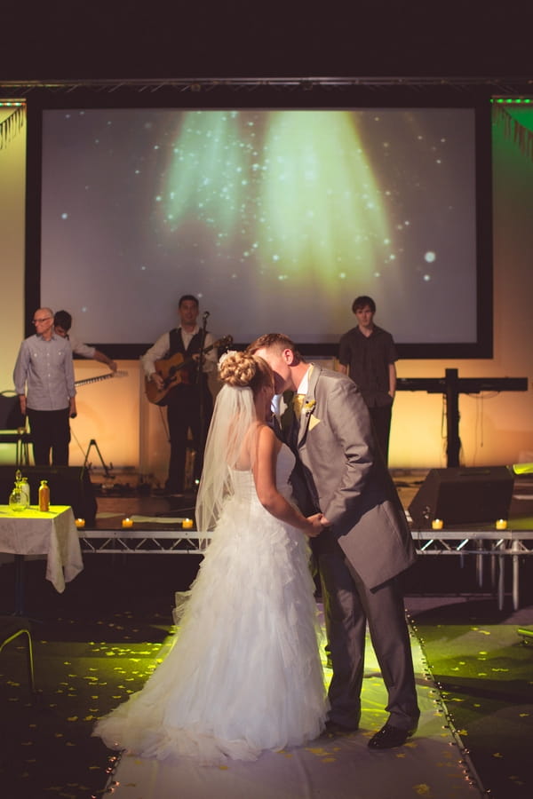 Bride and groom kiss