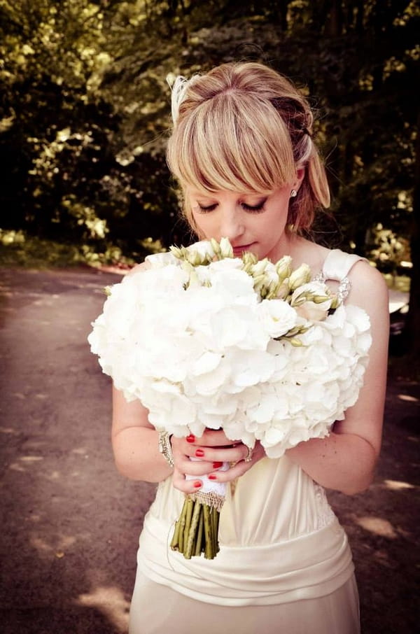Bride smelling bouquet