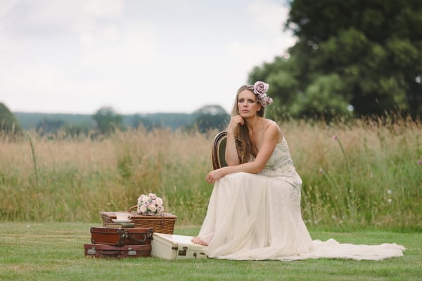 Bride sitting with vintage props