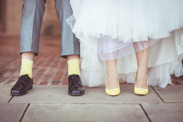 Bride's yellow shoes, groom's yellos socks