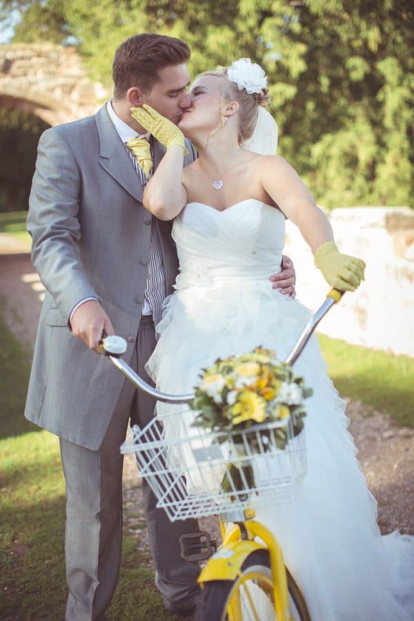 Bride and grom with yellow bike