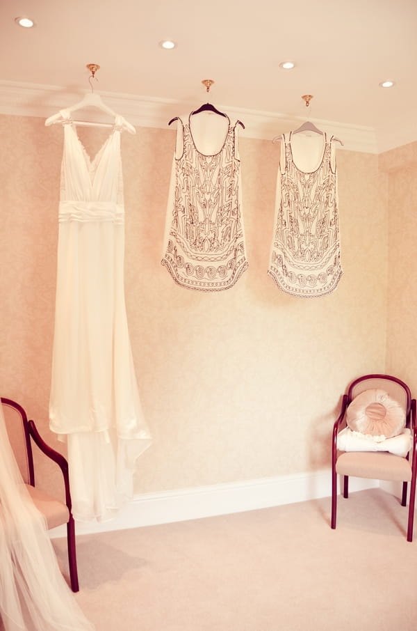 Wedding dress and bridesmaid dresses hanging