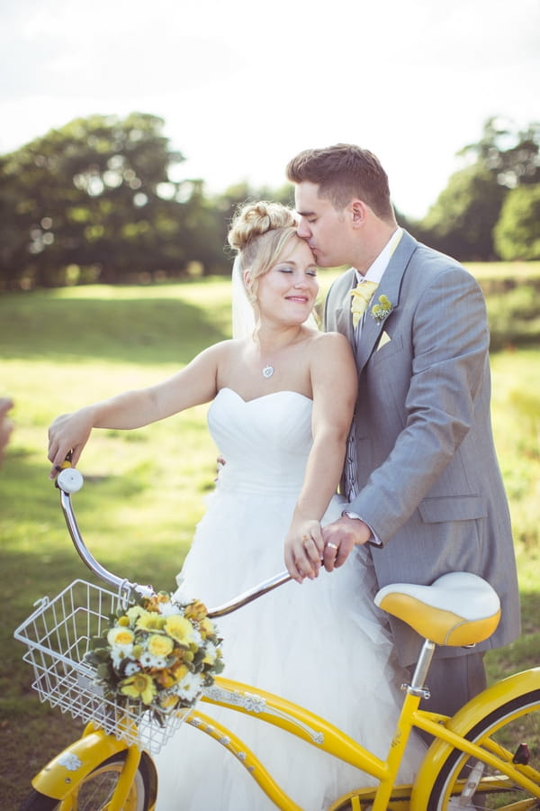 Bride and groom with yellow bike