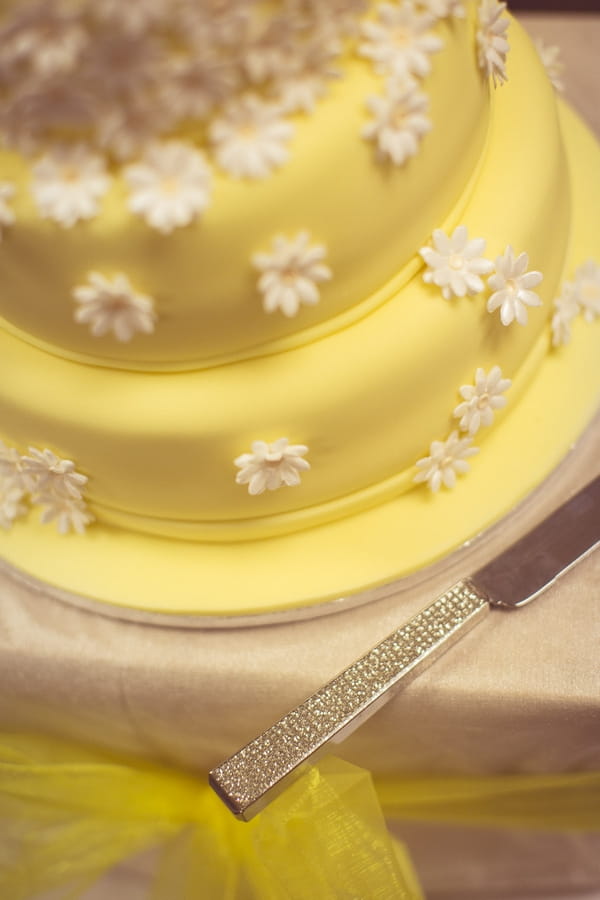 Flower detail on yellow wedding cake