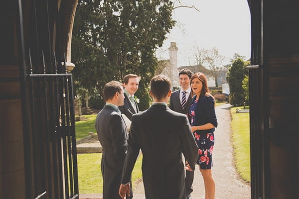 Wedding guests waiting outside church