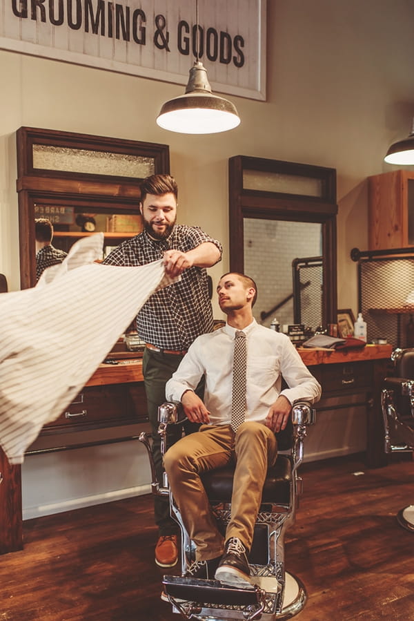 Man sitting in barber's chair