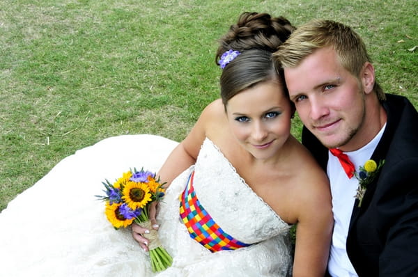 Bride and groom looking up