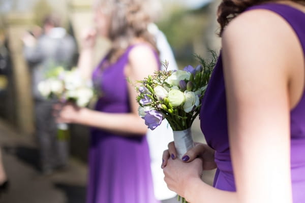 Bridesmaid holding bouquet