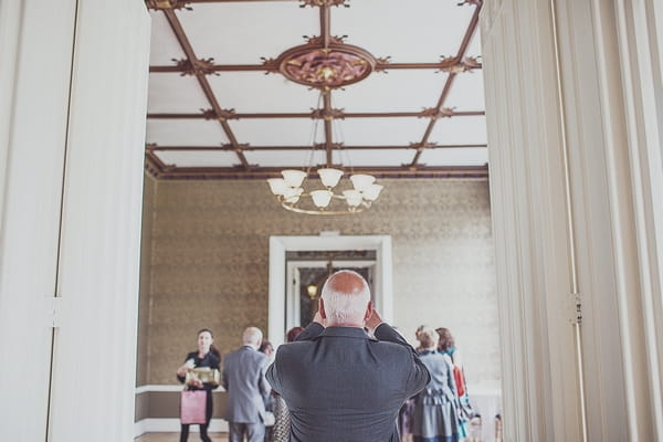 Man taking picture at Nonsuch Mansion