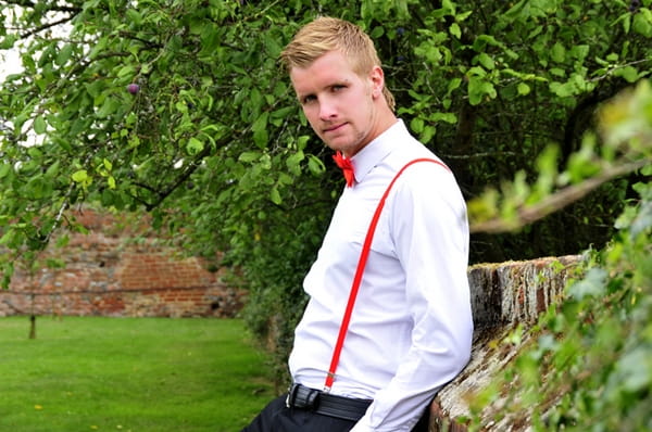 Groom with red bow tie and braces