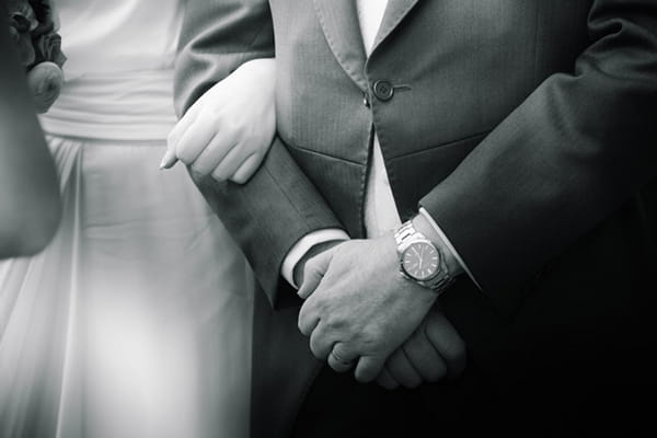 Bride holding father's arm