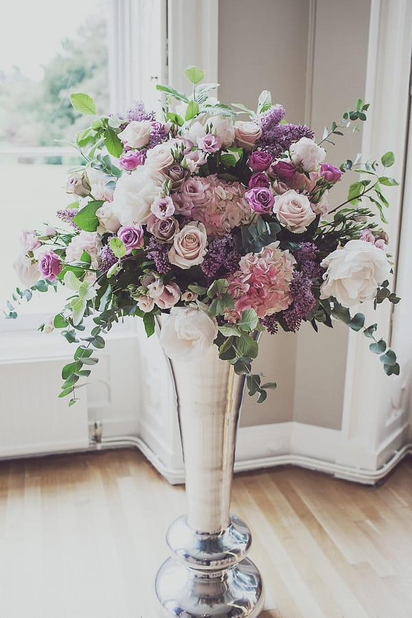 Tall vase of wedding flowers