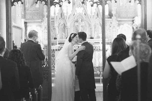 Bride and groom kiss