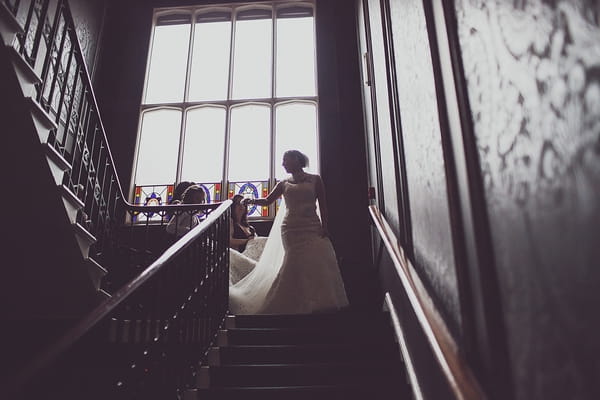 Bride walking down stairs at Nonsuch Mansion