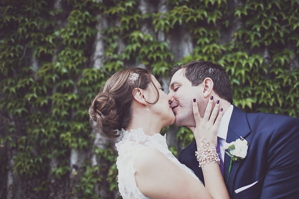 Bride and groom kiss