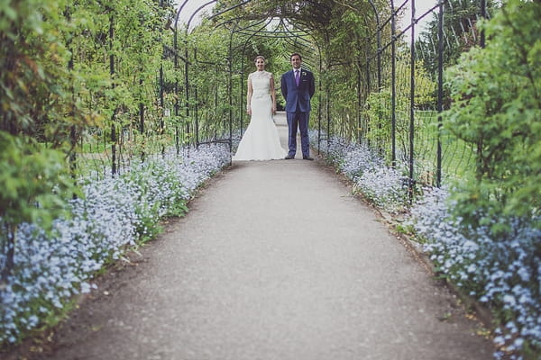 Bride and groom in garden of Nonsuch Mansion