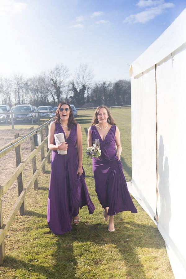 Bridesmaids in purple dresses