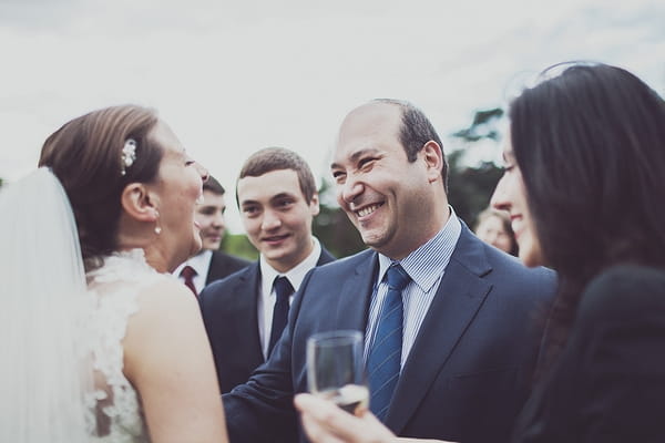 Bride laughing with wedding guest