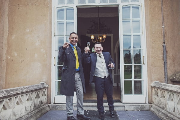 Wedding guests raising glasses