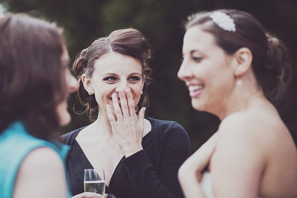 Bride talking to wedding guests