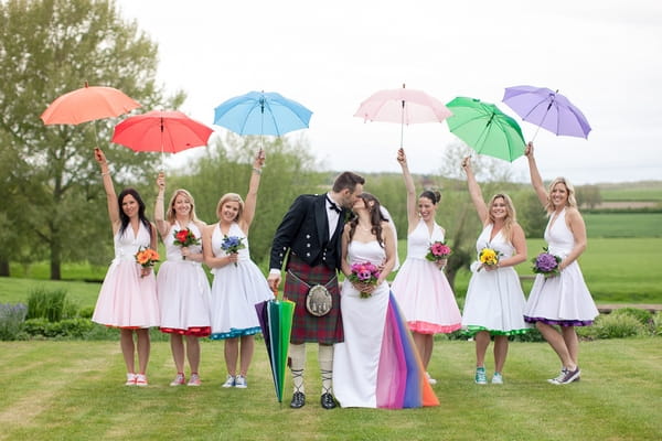 Bridesmaids with coloured umbrellas