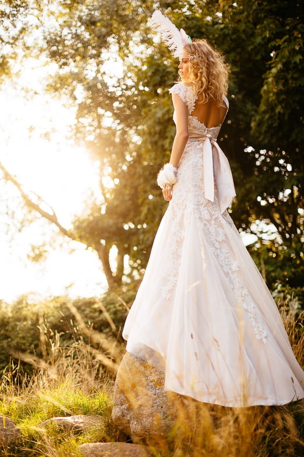 Boho bride with feather in hair