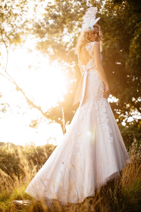 Boho bride standing on rock