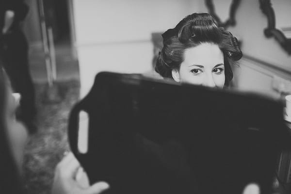 Bride looking in mirror