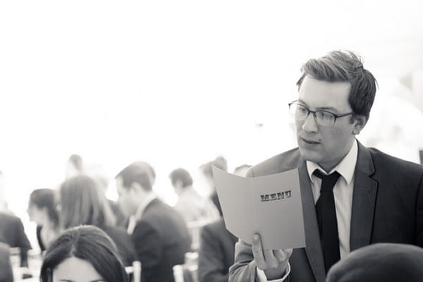 Wedding guest reading menu