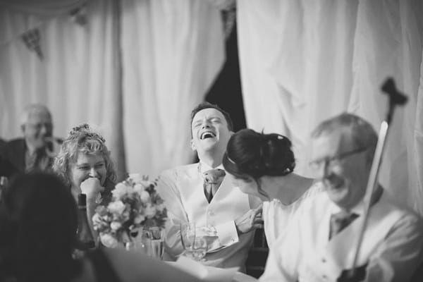 Groom laughing