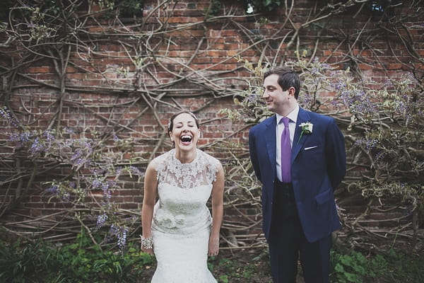 Bride laughing with groom