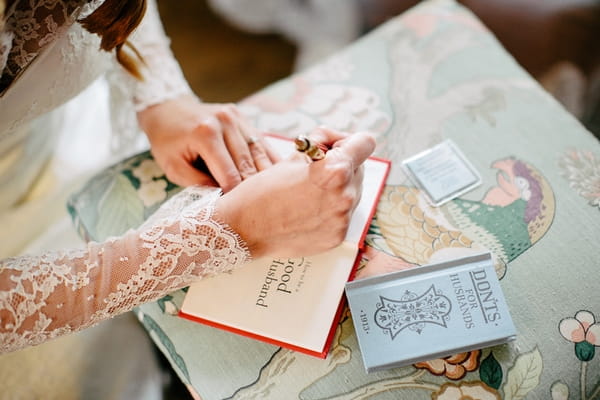 Bride writing in book