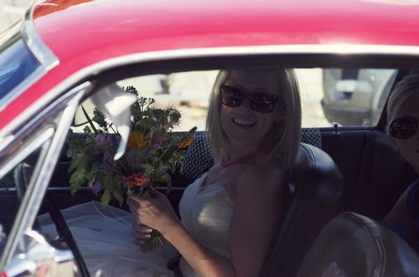 Bride in wedding car