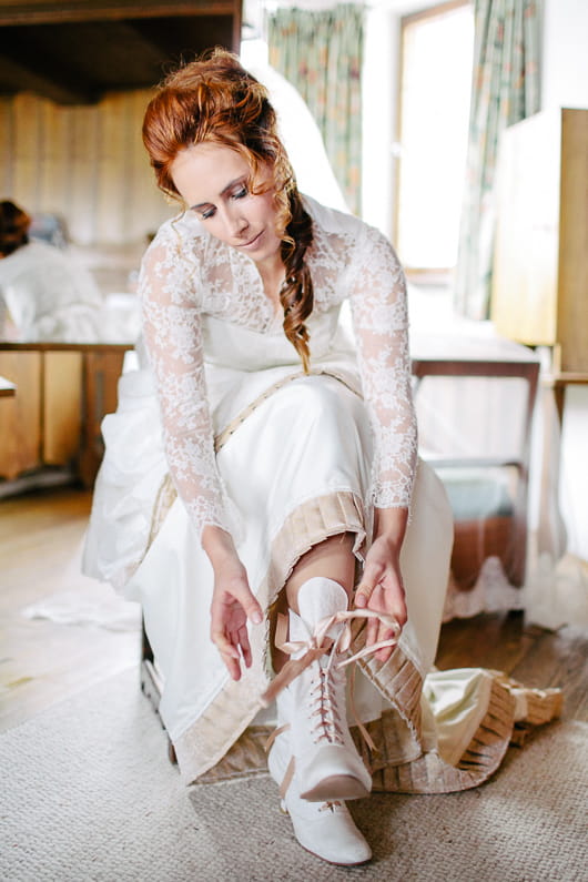 Bride doing up boots