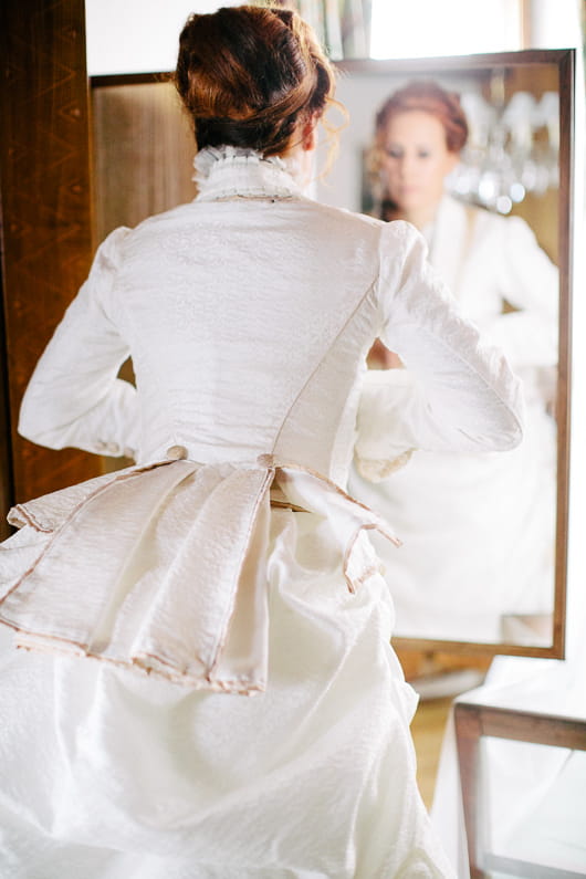 Bride looking in mirror