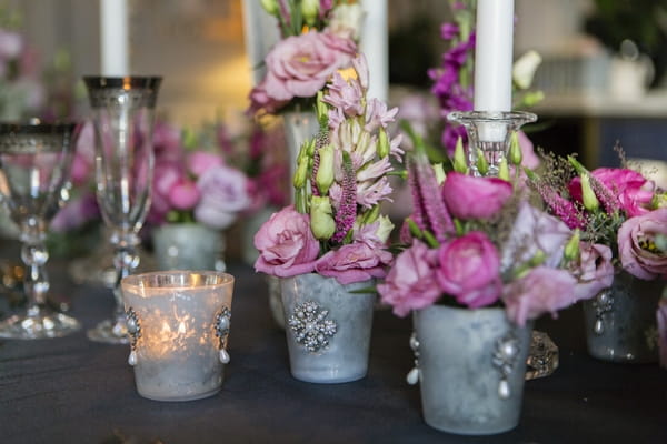 Small pots of wedding table flowers