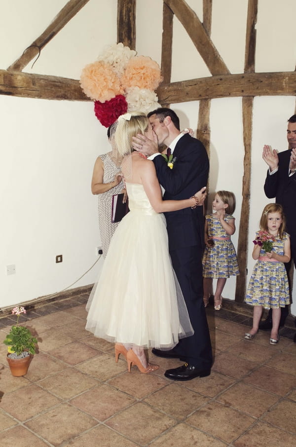 Bride and groom kiss