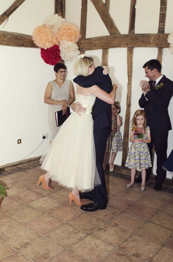 Bride and groom hug