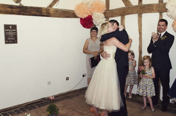 Bride and groom hug