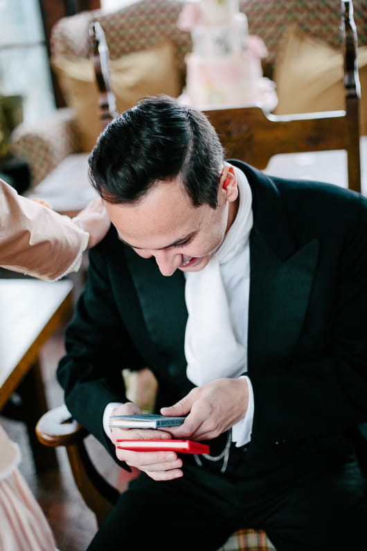 Groom looking at books