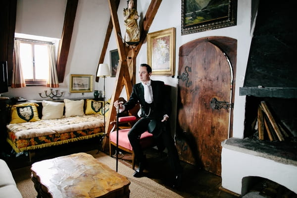 Groom in morning suit with cane