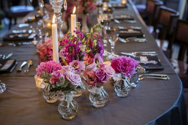 Glass vases of wedding table flowers