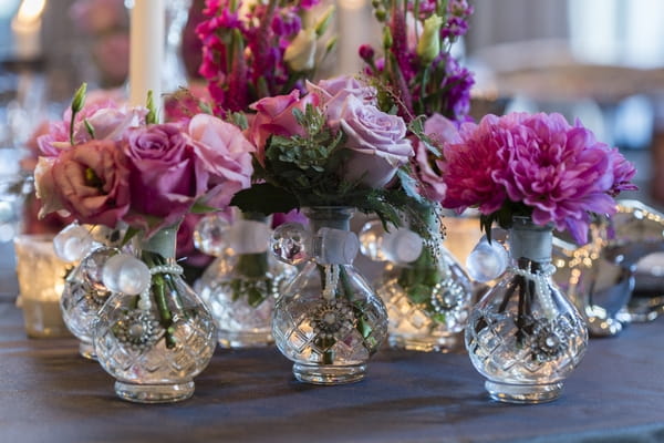 Glass vases of wedding table flowers