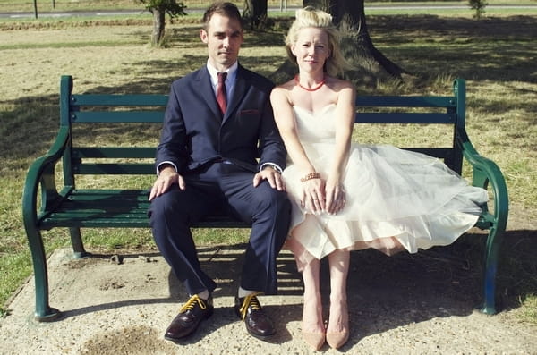 Bride and groom on bench