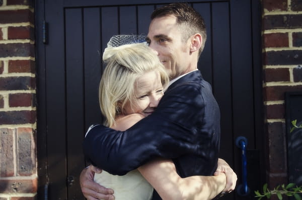 Bride and groom hug