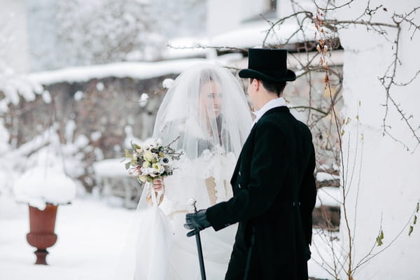 Bride and groom in snow