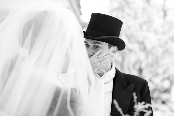 Groom wiping away tear